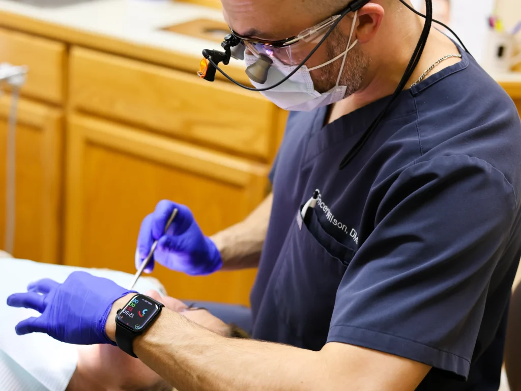 Dr. Wilson seeing a patient for a dental emergency