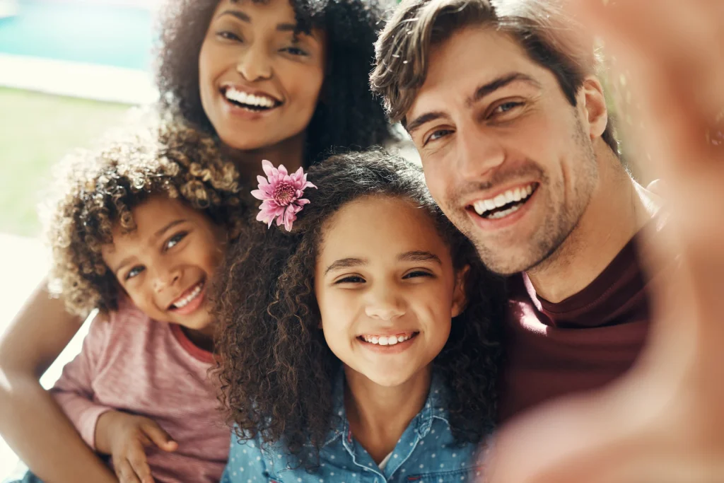 Family smiling with nice teeth | In-house dental membership plans in Wiggins, MS